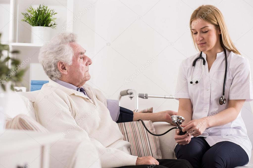 Doctor measuring blood pressure