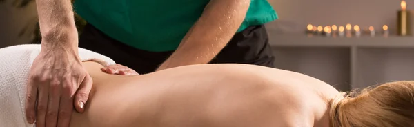 Lower back therapeutic massage — Stock Photo, Image