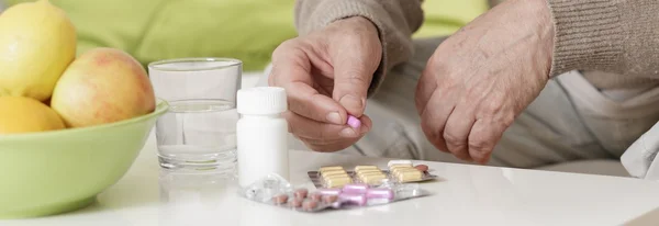 Elder man taking remedy — Stock Photo, Image