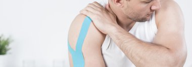 Man with shoulder pain clipart
