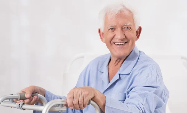 Ill man with walking frame — Stock Photo, Image