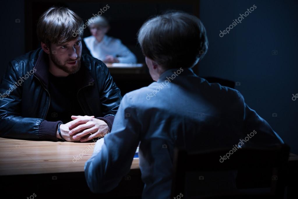 Interrogation in a dark room Stock Photo by ©photographee.eu 80767456