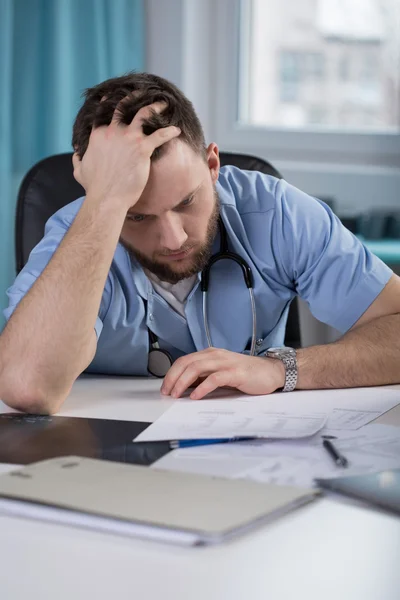 Young Doctor is concerned about work — Stock Photo, Image