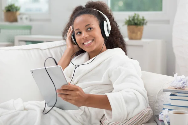 Girl with tablet and headphones — Stock Photo, Image