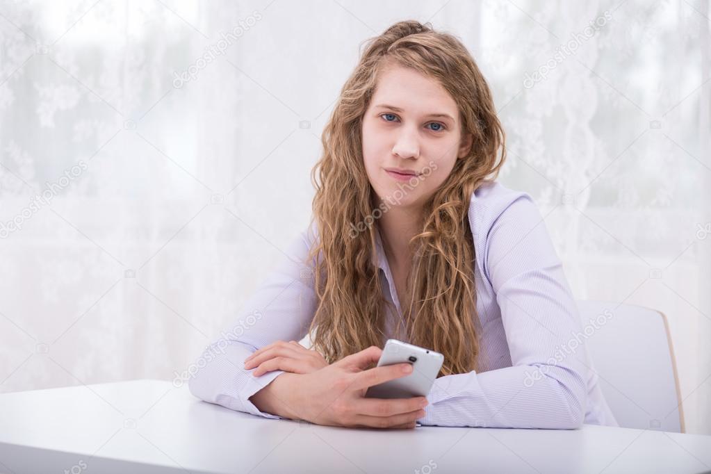 Responsible teenager with mobilephone