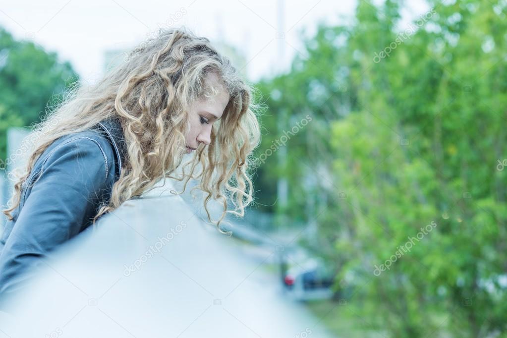 Woman standing on the bridge