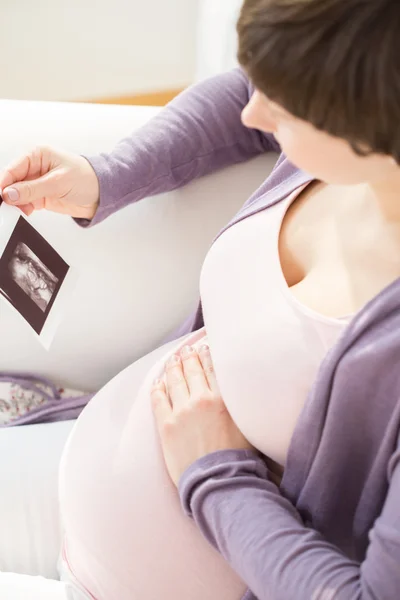 Touching the baby bump — Stock Photo, Image