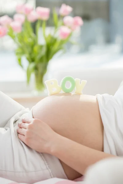 Letters on belly — Stock Photo, Image