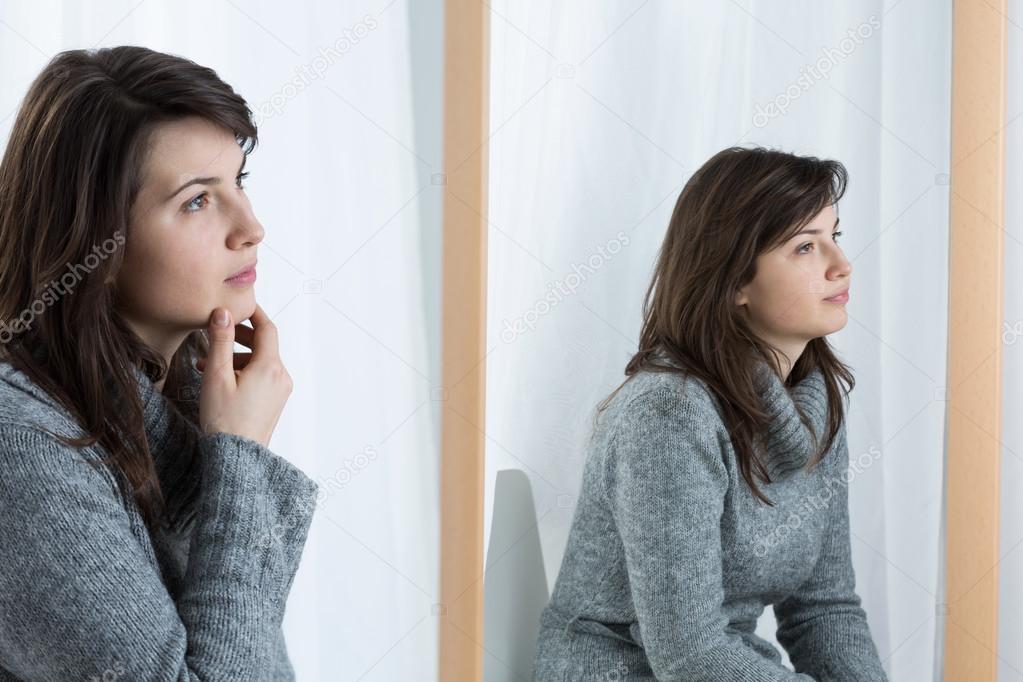 Bored woman masking her emotions