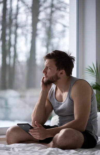 Sleepy man thinking about girlfriend — Stock Photo, Image