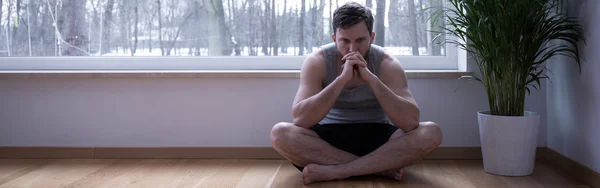 Stressed male sitting on floor — Stock Photo, Image