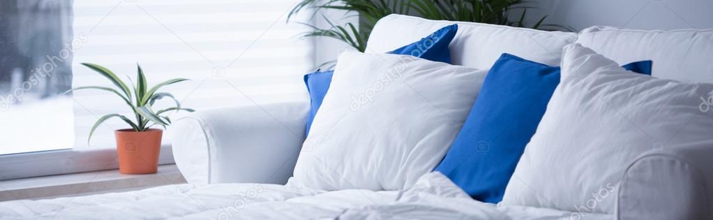 Comfortable bed with neat bedding 