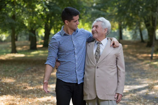 Father and son in park — Stock Photo, Image