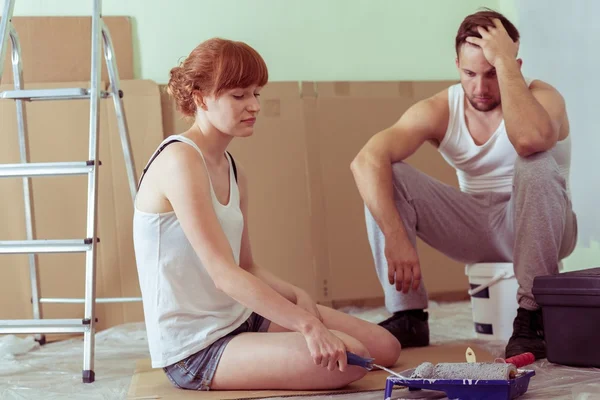 Despair couple renovating house — Stock Photo, Image