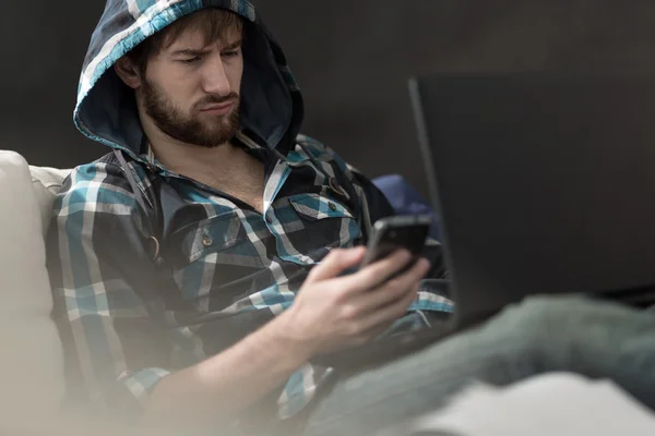 Guy reading a text message — Stock Photo, Image