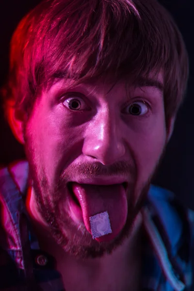 LSD blotter on the tongue — Stock Photo, Image