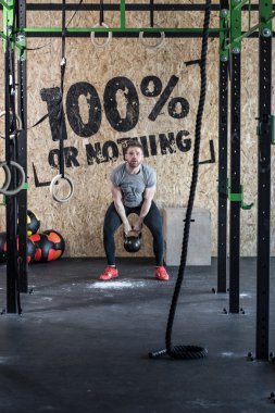 Man training with kettlebell