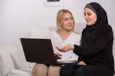 Arab immigrant talking with her family clipart