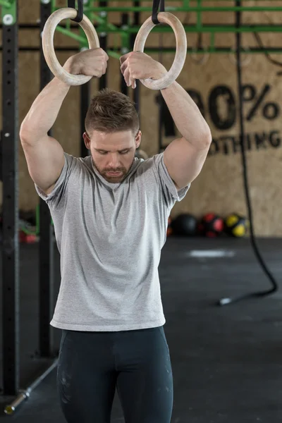 Strongman with gymnastic rings — Zdjęcie stockowe