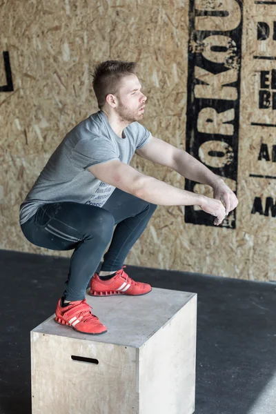 Man on the plyo box — 스톡 사진