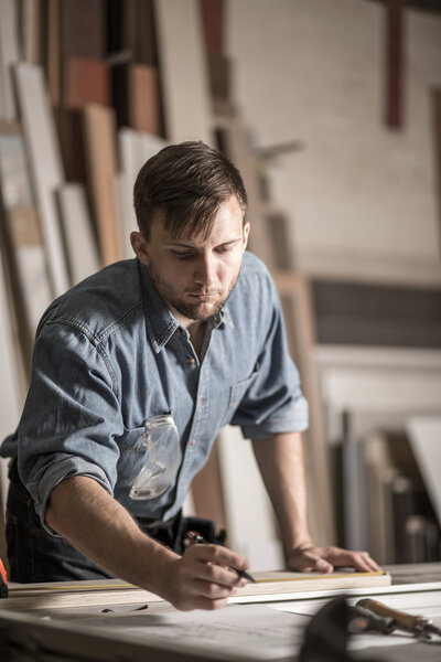 Carpenter at work in workshop