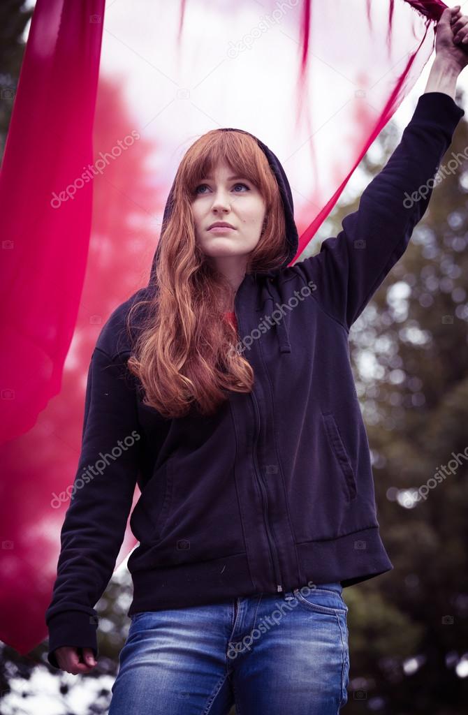 Rebellious woman with red flag