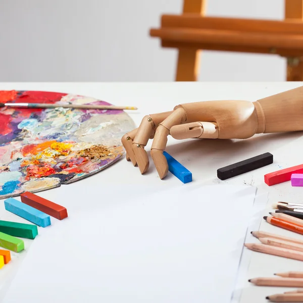 Tools and hand paints black pastel — Stock Photo, Image