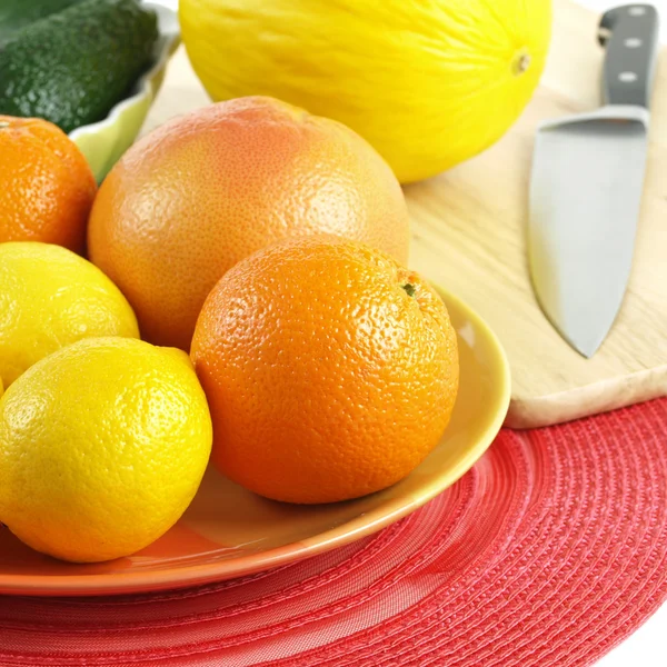 Juicy citrus fruit on orange plate, square — Stock Photo, Image