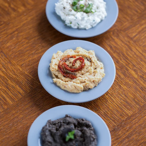Cottage cheese, hummus and tapenade — Stock Photo, Image