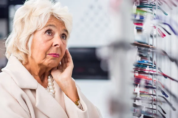 Problem with choosing eyeglasses — Stock Photo, Image