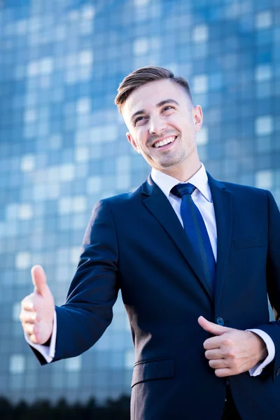Businessman greeting with somebody — Stock Photo, Image