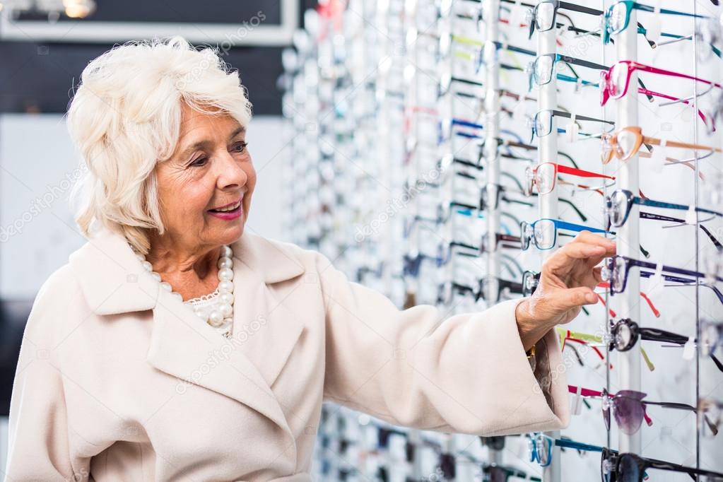 Senior woman buying eyeglasses