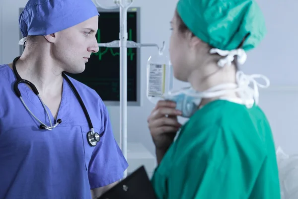Two surgeons in sterile scrubs — Stock Photo, Image