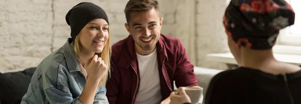 Pareja joven y amigo — Foto de Stock