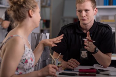 Police officer interrogating woman clipart