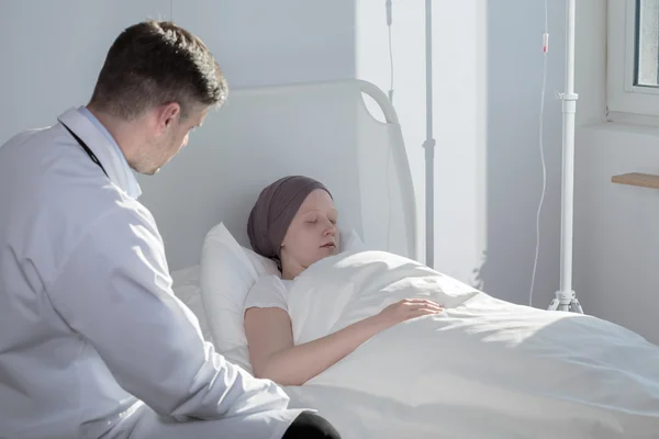 Medic and sleeping cancer child — Stock Photo, Image