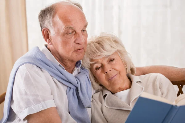 Senior couple reading together