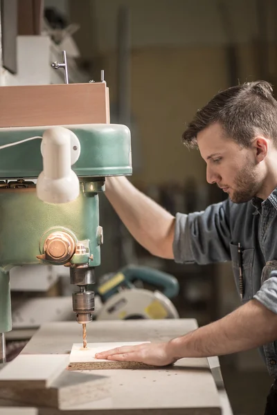 Carpenter using drill — Stock Photo, Image