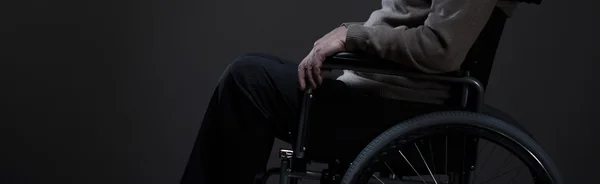 Person sitting on a wheelchair — Stock Photo, Image