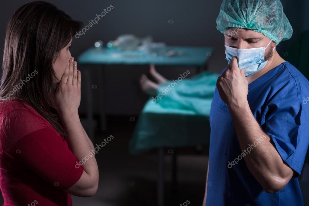 Doctor informing about failed operation Stock Photo by ©photographee.eu 91292746