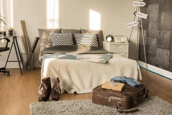 Traveler bedroom with decorative signpost