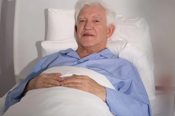 Elderly patient in bed — Stock Photo, Image