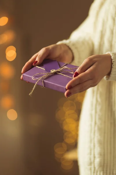 Lady holding seasonal xmas gift — Stock Photo, Image