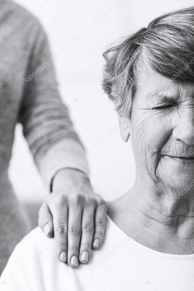 Old woman suffering from illness