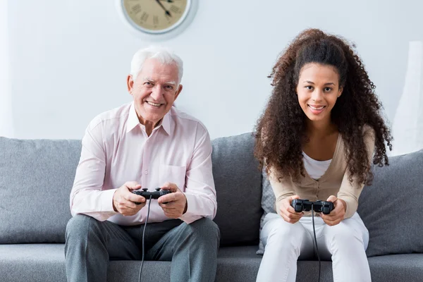 Holding joysticks and playing games — Stock Photo, Image