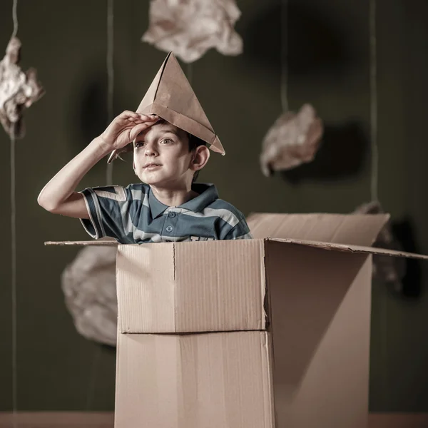 Boy with paper hat — Stock Photo, Image