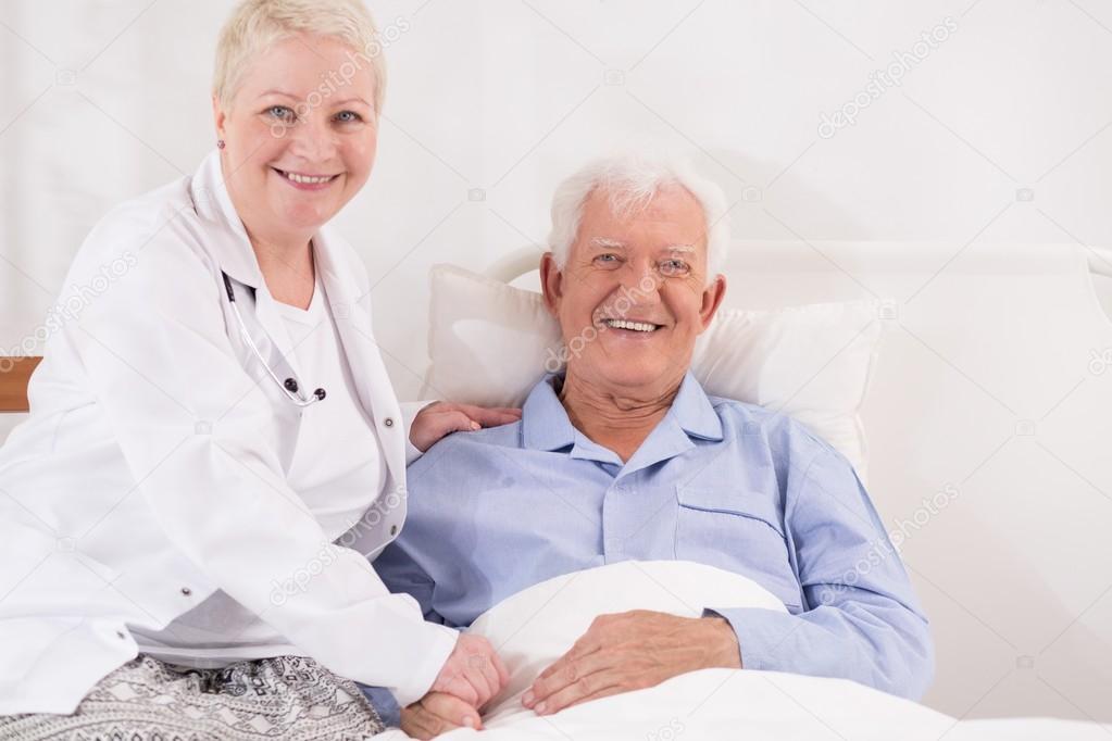 Elderly patient recovering in bed