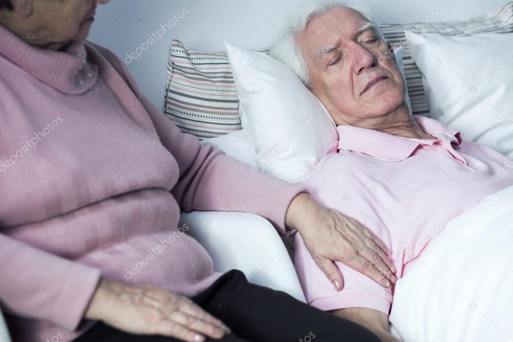 Woman supporting man with disease