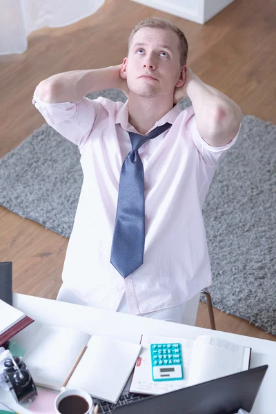 Exhausted man preparing for exams — Stock Photo, Image