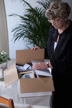 Bereaved female sorting things clipart